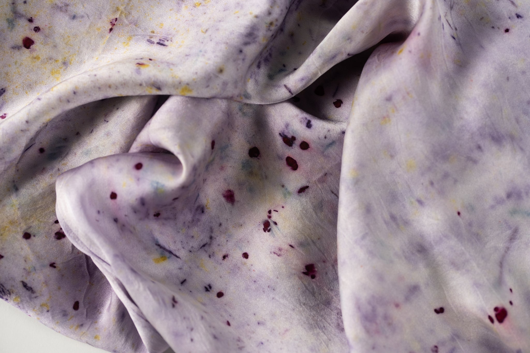 Abstract botanically dyed silk pillowcase in purple by DyeKween, close-up of soft fabric detail