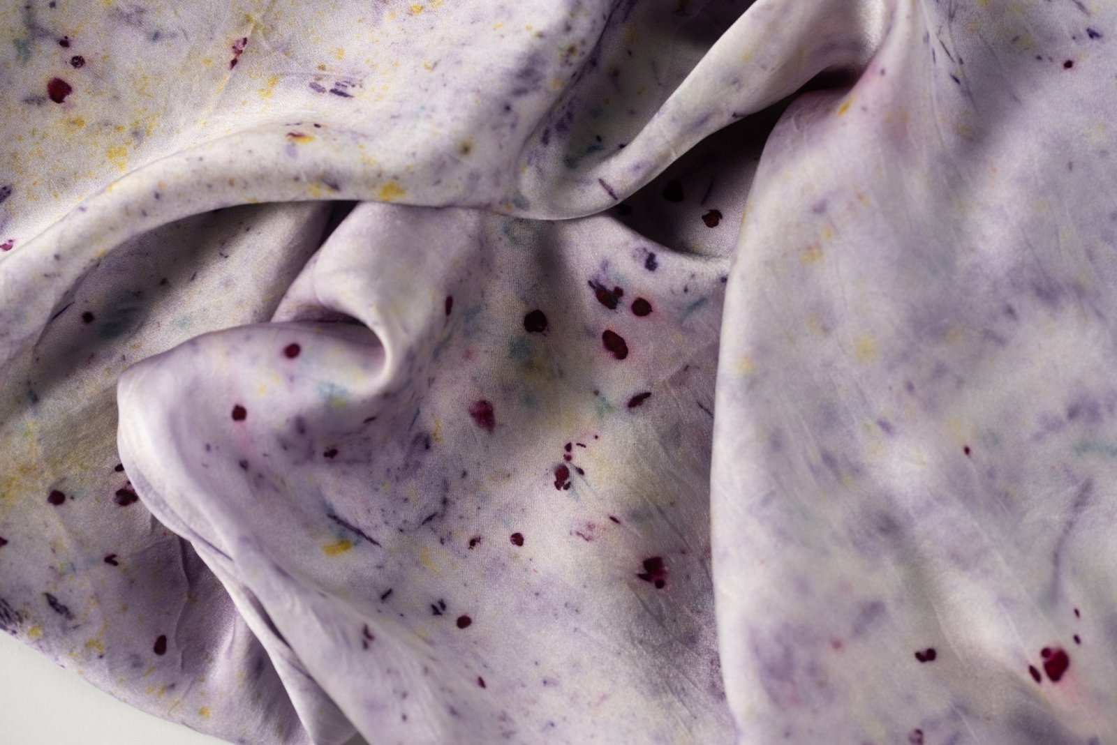Abstract botanically dyed silk pillowcase in purple by DyeKween, close-up of soft fabric detail