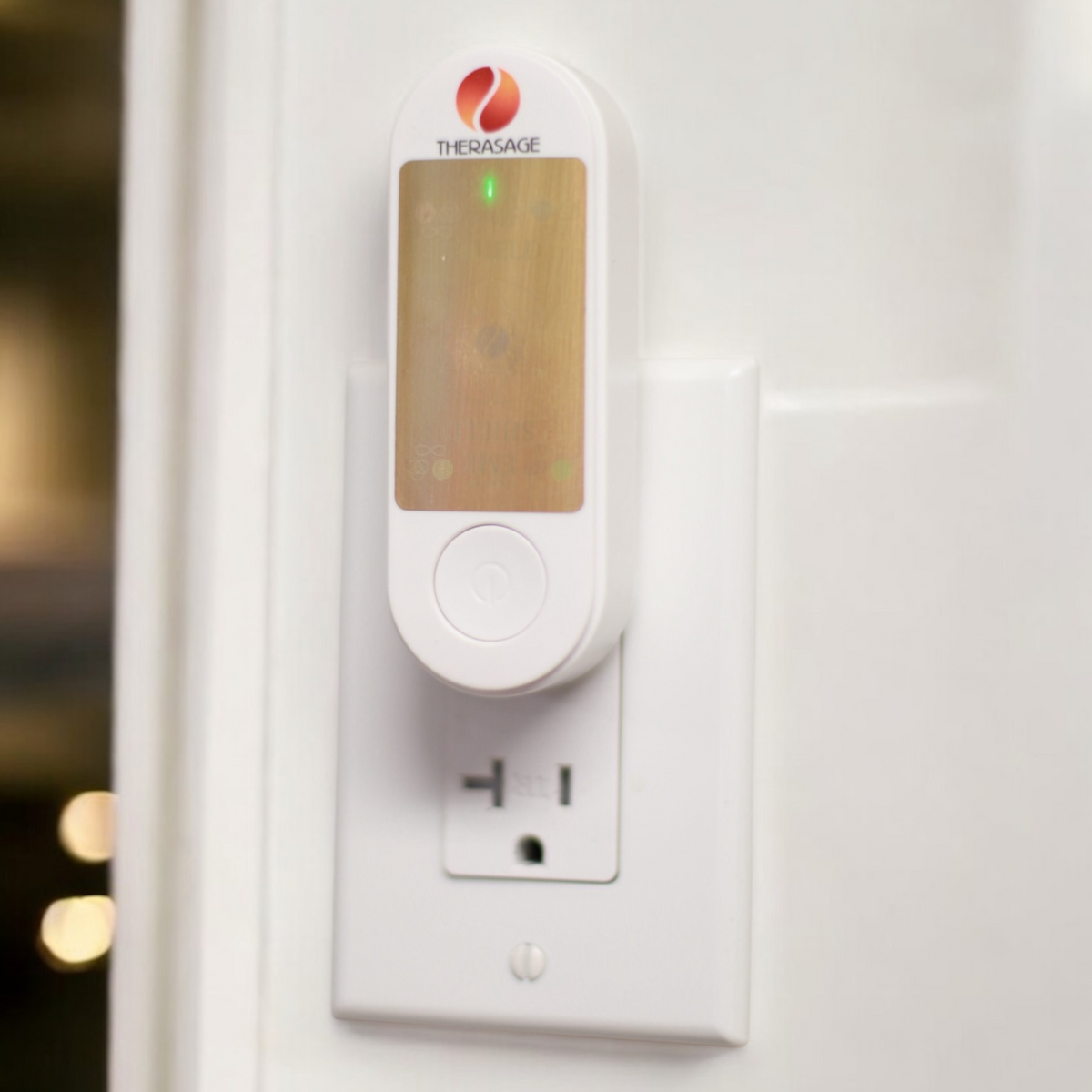 Therasage TheraProtect EMF Home Harmonizer plugged into an outlet on a white wall