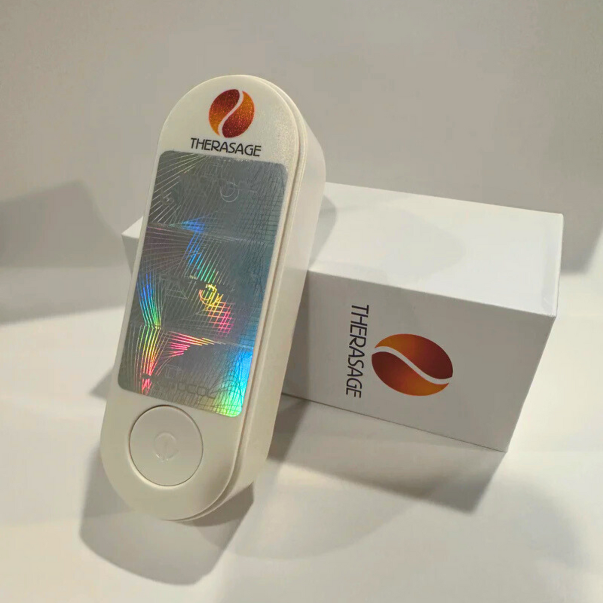 Therasage TheraProtect EMF Home Harmonizer with holographic panel leaning on its white box