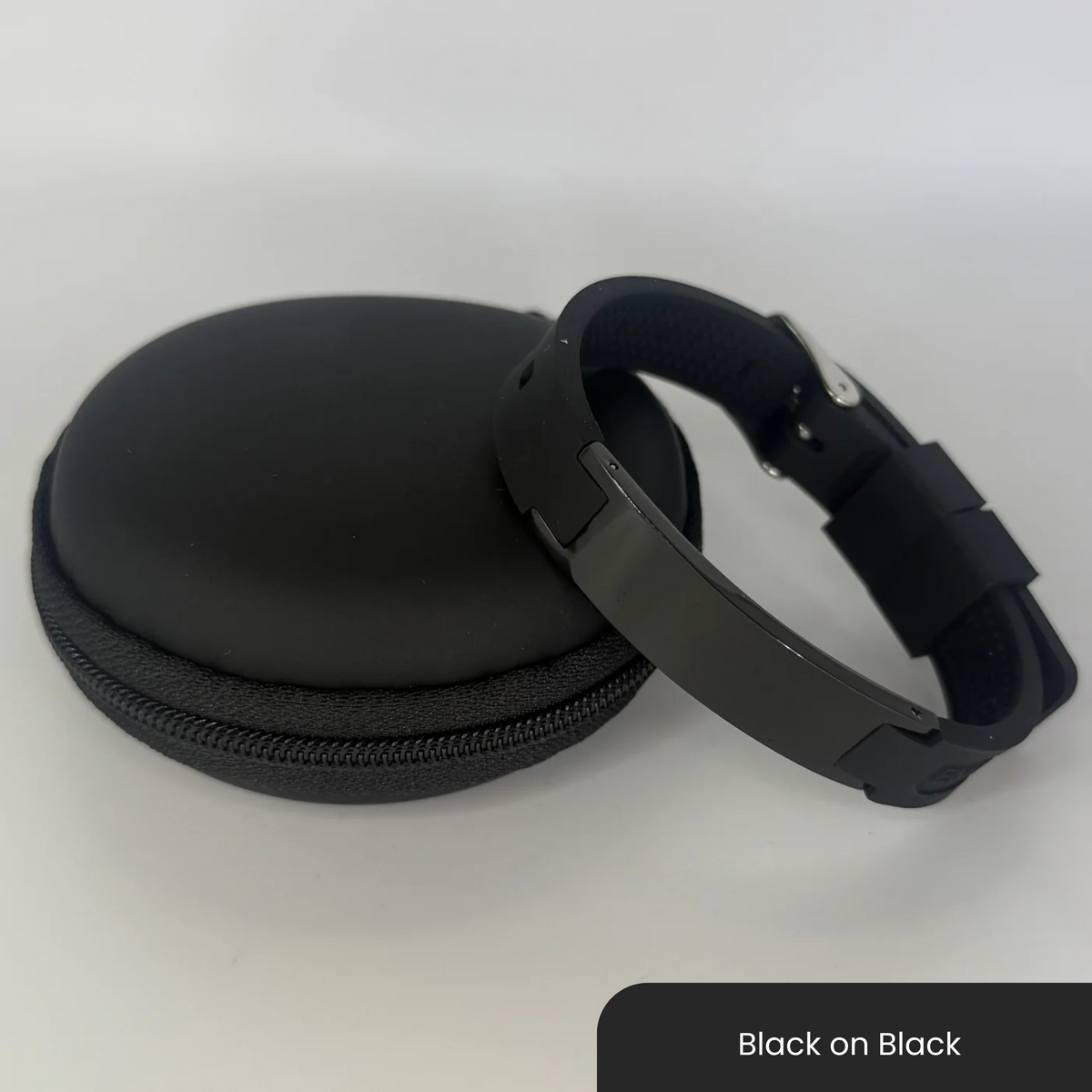 Therasage Bio Band Sport bracelet in Black on Black beside a black zip case
