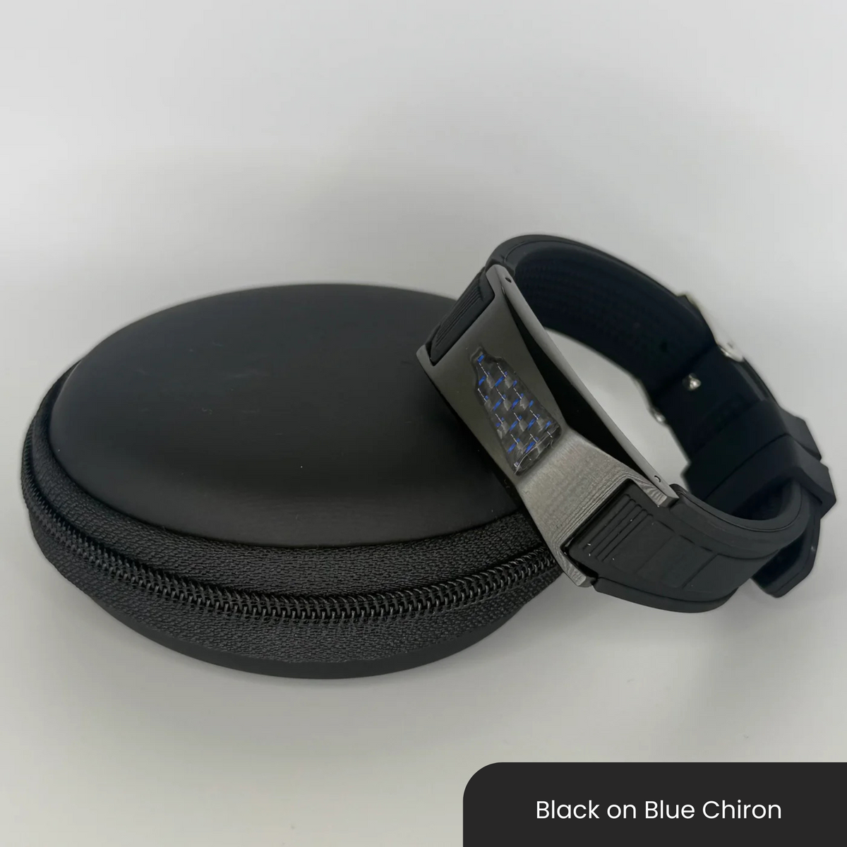 Therasage Bio Band Sport bracelet in Black on Blue Chiron beside a black zip case