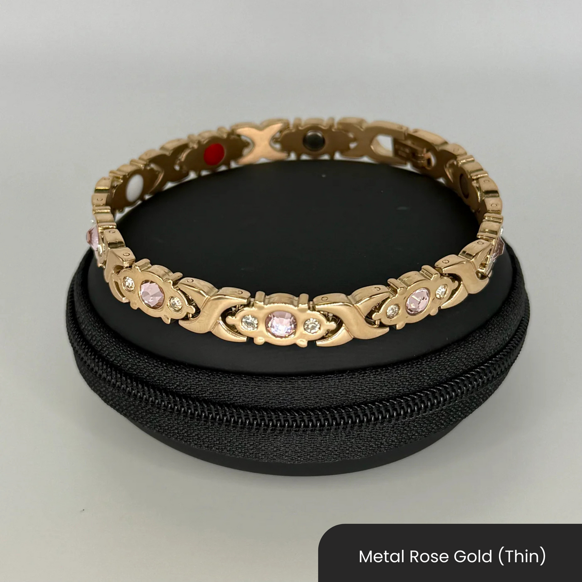 Therasage Bio Band metal bracelet in Metal Rose Gold (Thin) with crystals on a black zip case