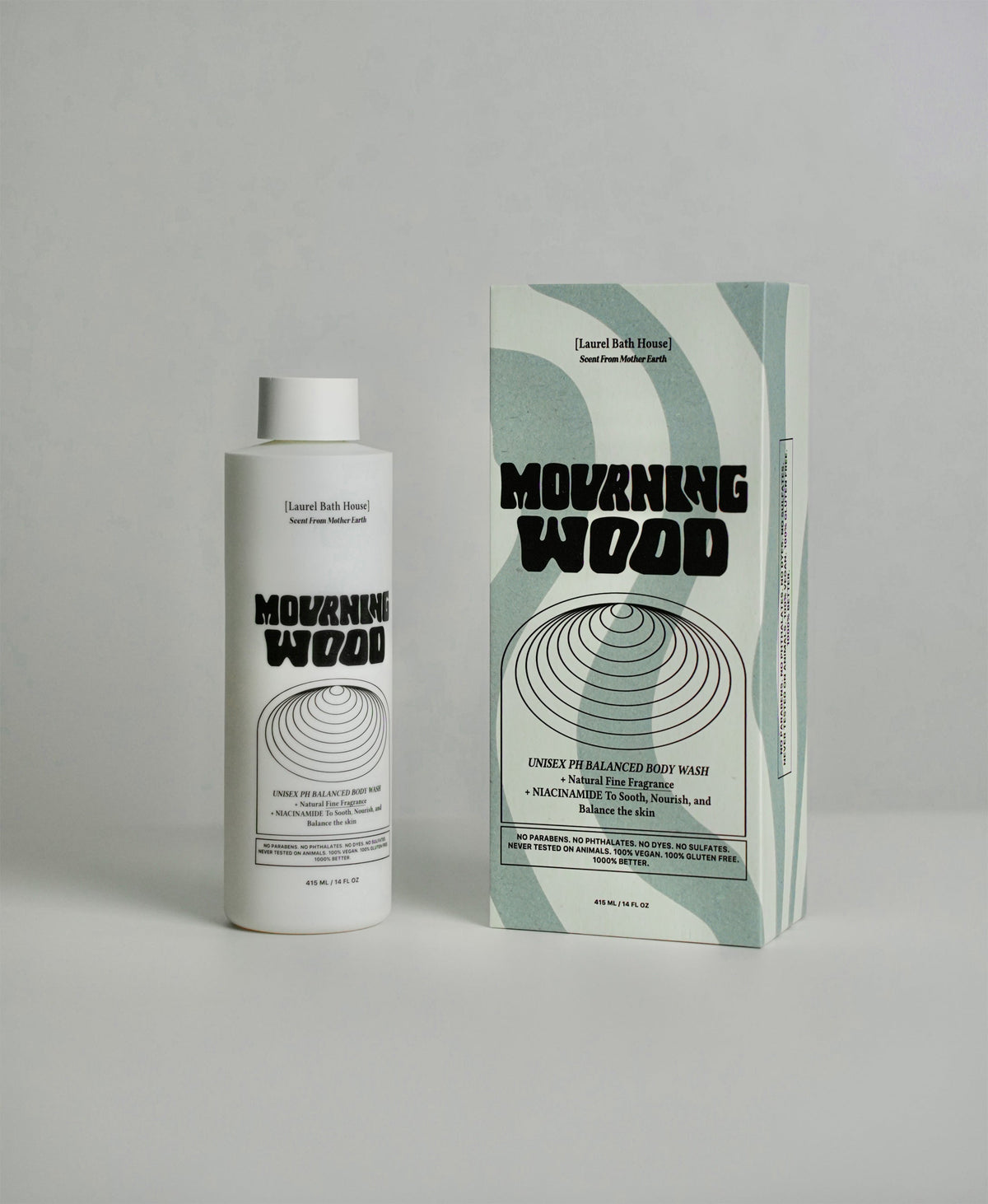 Laurel Bath House Mourning Wood body wash bottle beside its green and white box