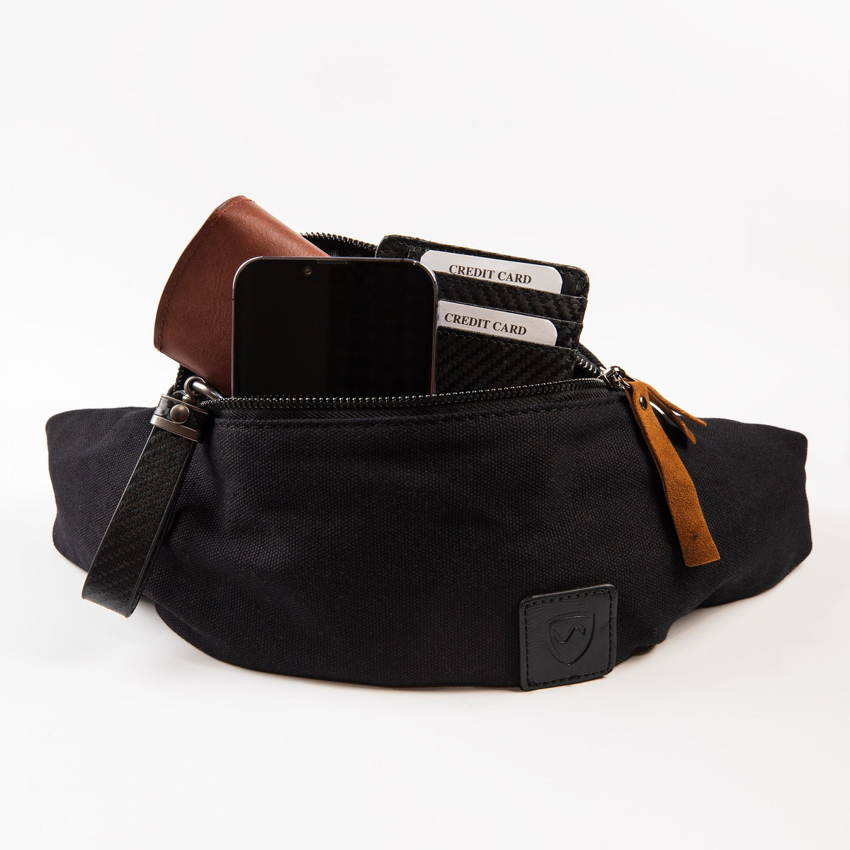Shield Your Body Canvas Traveler Fanny Pack with a phone, wallet and credit cards in the front zip pocket