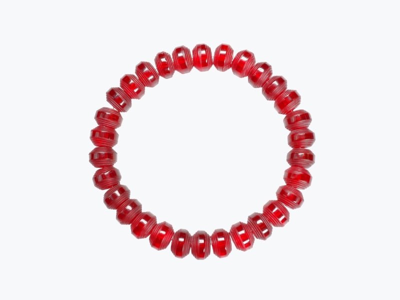 Somavedic red Bracelet laid flat in a circle on white