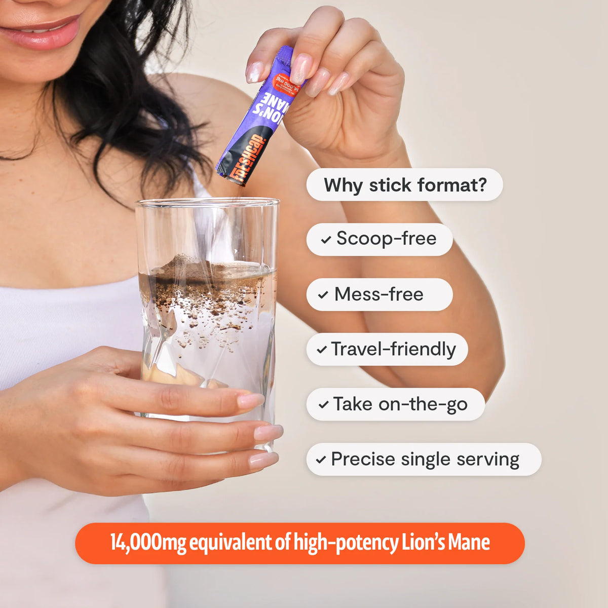 Woman pouring a FreshCap Mushrooms Lion's Mane Powder stick into a glass: scoop-free, mess-free, travel-friendly, 14,000mg