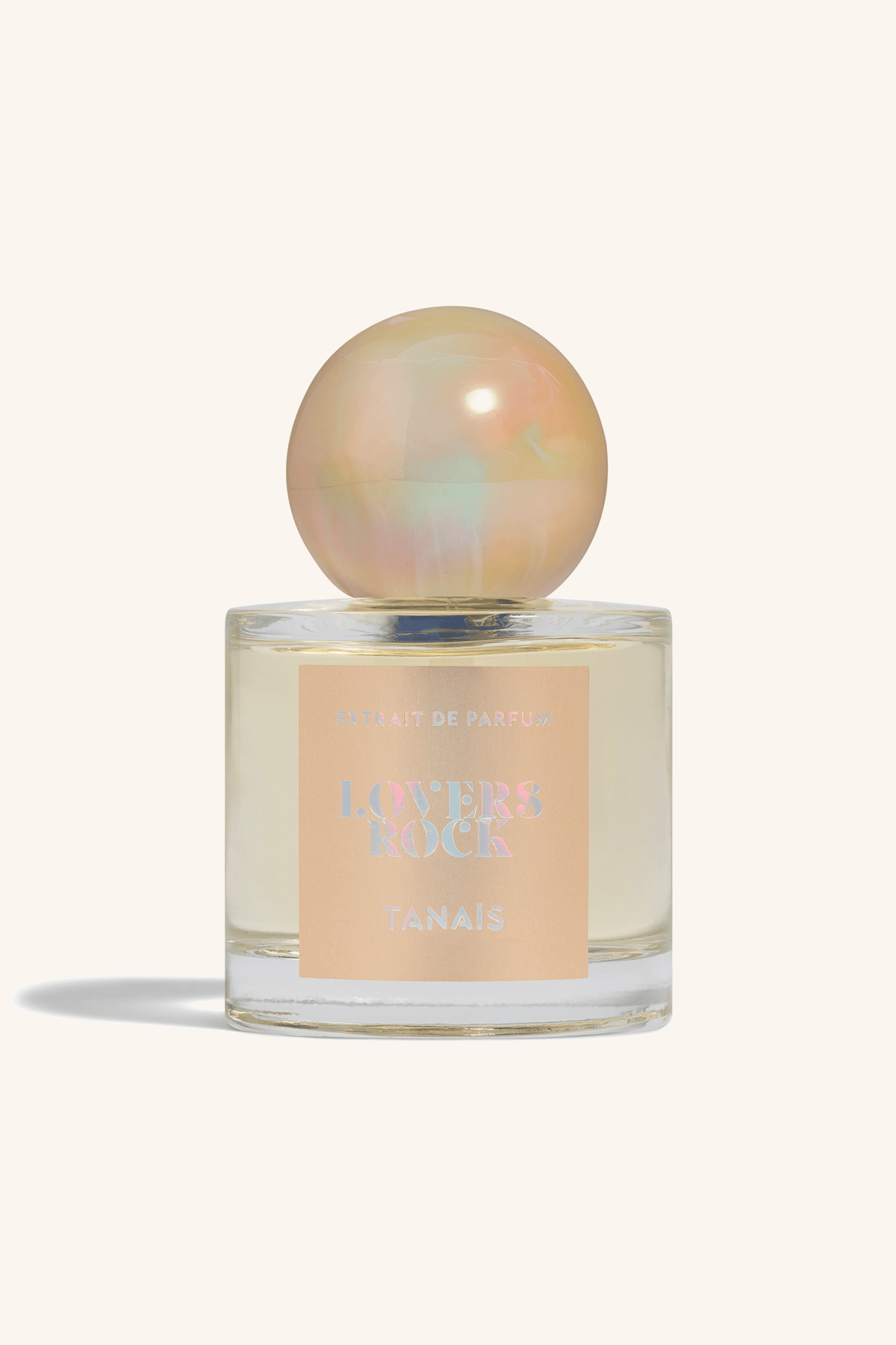 TANAÏS Lovers Rock Extrait de Parfum bottle with a peach label and pearl cap, front view
