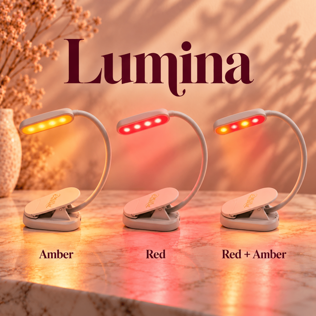 DreamWalkerz Lumina blue light-free clip-on reading lamp in its three light modes: amber, red, and red + amber