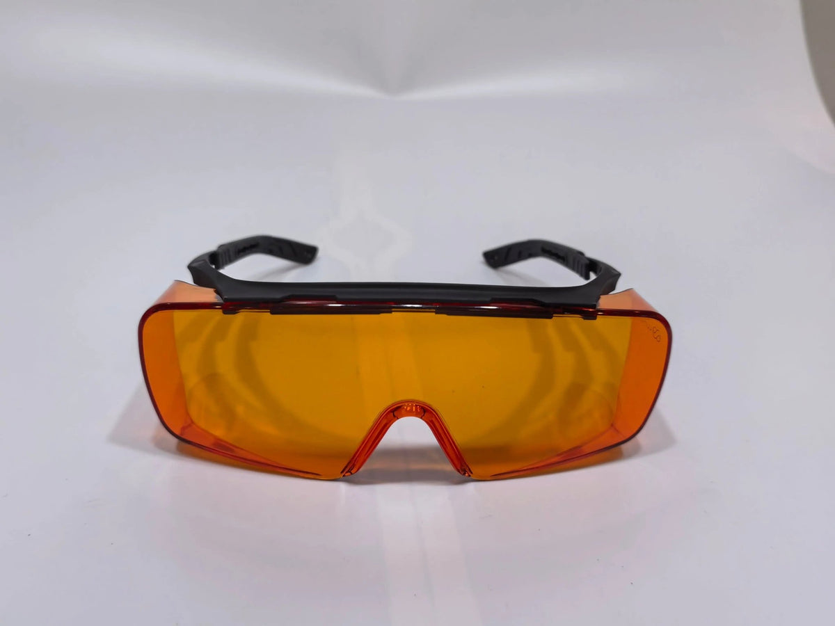 Lumos Sleep Blue Blocker orange fit-over glasses with side shields, front view