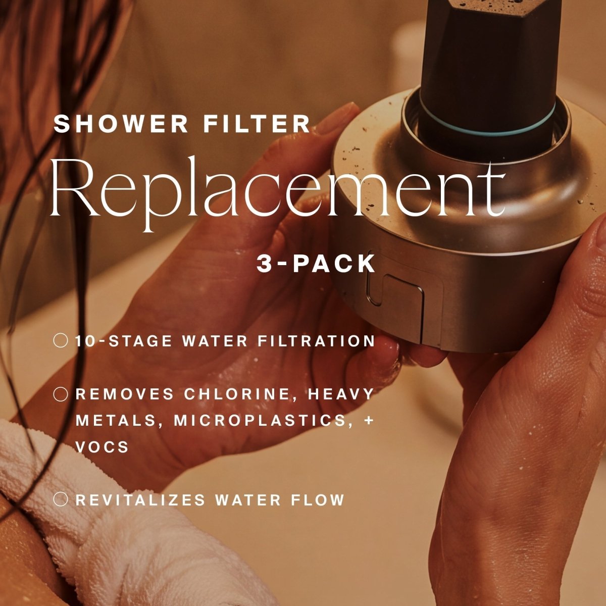 Hands holding a silver HigherDOSE shower filter replacement: 3-pack, 10-stage filtration