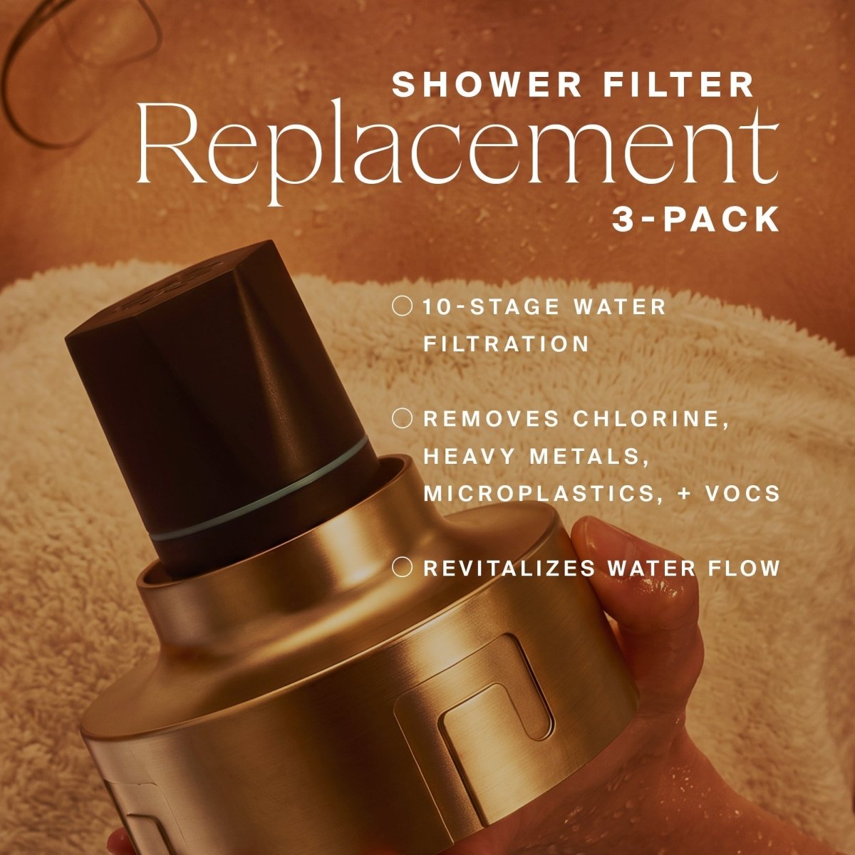 Hands holding a gold HigherDOSE shower filter replacement on a white towel: 3-pack, 10-stage filtration