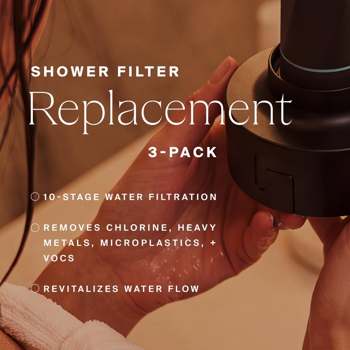 Hands installing a replacement filter in the black HigherDOSE showerhead: 3-pack, 10-stage filtration