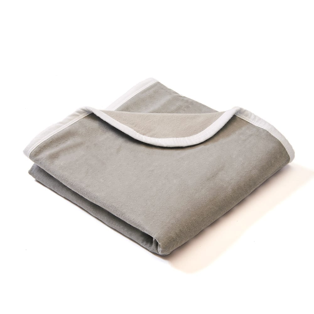 Shield Your Body Baby Blanket in solid gray folded over a white trim