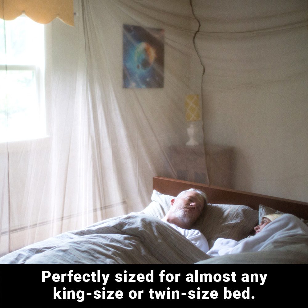 Couple asleep under the Shield Your Body Faraday Bed Canopy: sized for almost any king-size or twin-size bed