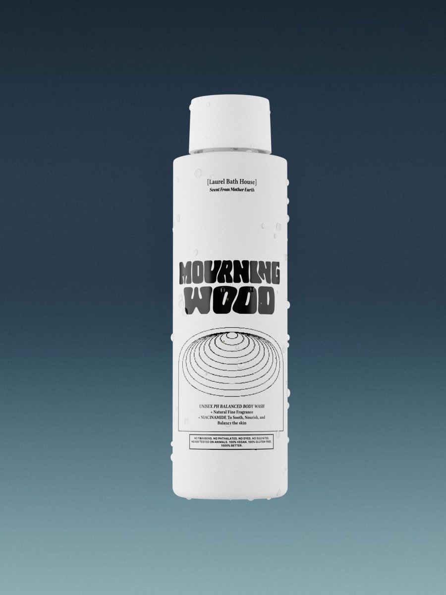 Laurel Bath House The Original Mourning Wood body wash bottle on a blue gradient