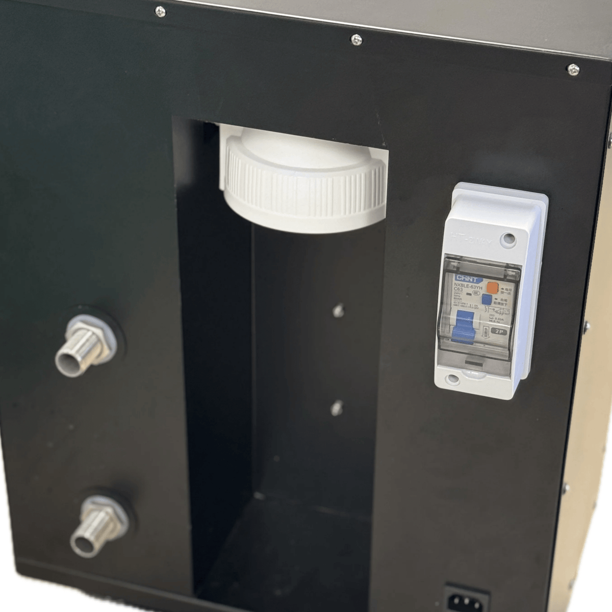 Inside the Therasage TheraFrost Flow showing the filter housing, water fittings and circuit breaker