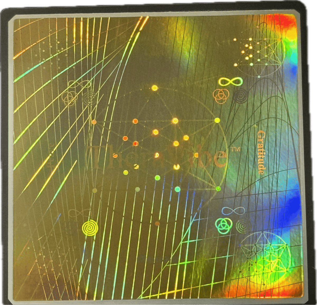Close-up of a holographic Therasage TheraVibe Freshness Card with rainbow reflections