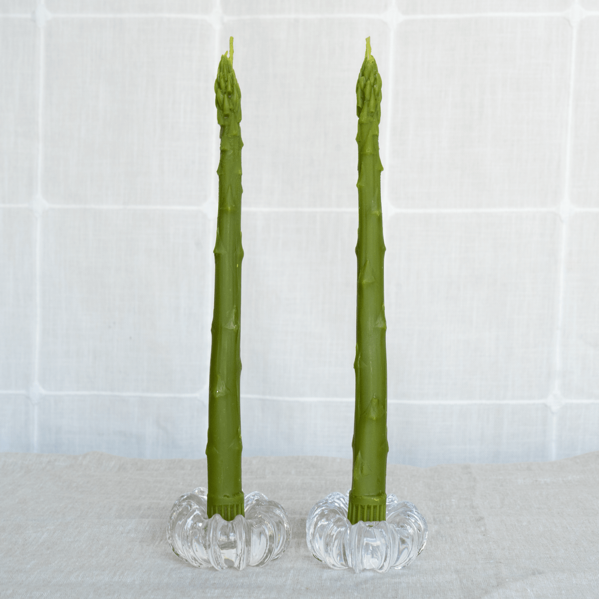 Happy Organics Asparagus Beeswax Taper Candles on a dining table