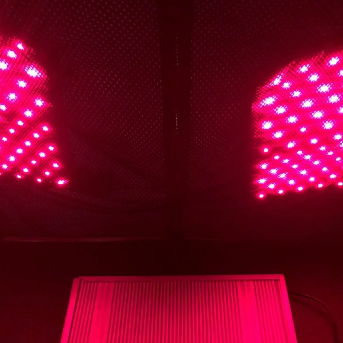 Thera360 Plus Portable Infrared Sauna by Therasage shown set up with dramatic red light glow