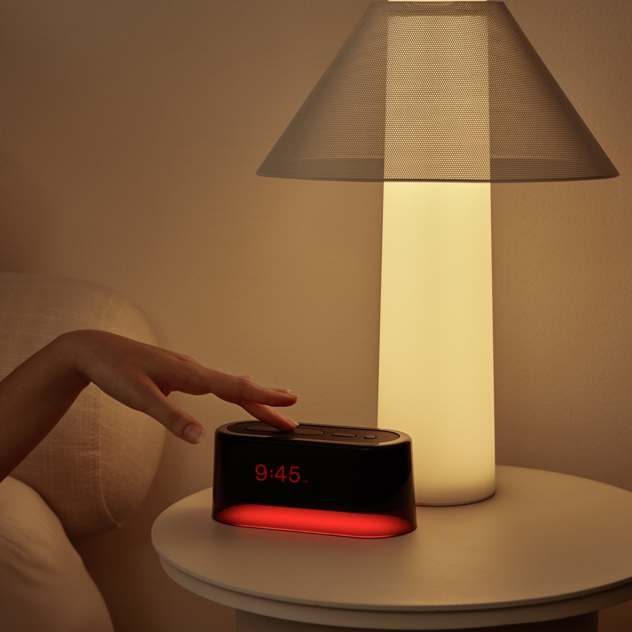 Loftie rblack/red clock on a nightstand at nanaka.co