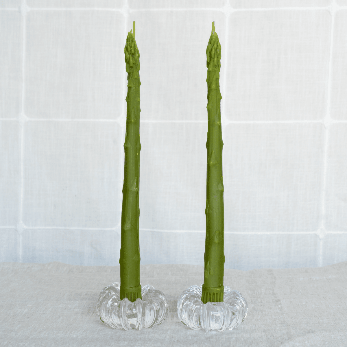 Happy Organics Asparagus Beeswax Taper Candles on a dining table