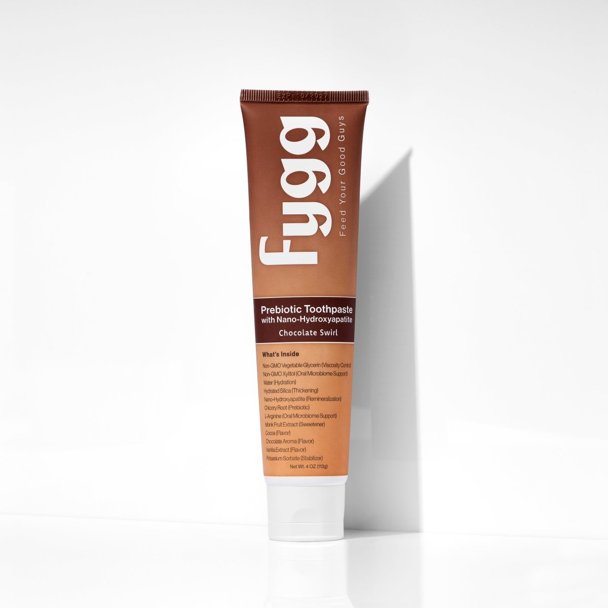 Fygg Nano-Hydroxyapatite Toothpaste with Prebiotics in Chocolate Swirl, a brown tube on a white background