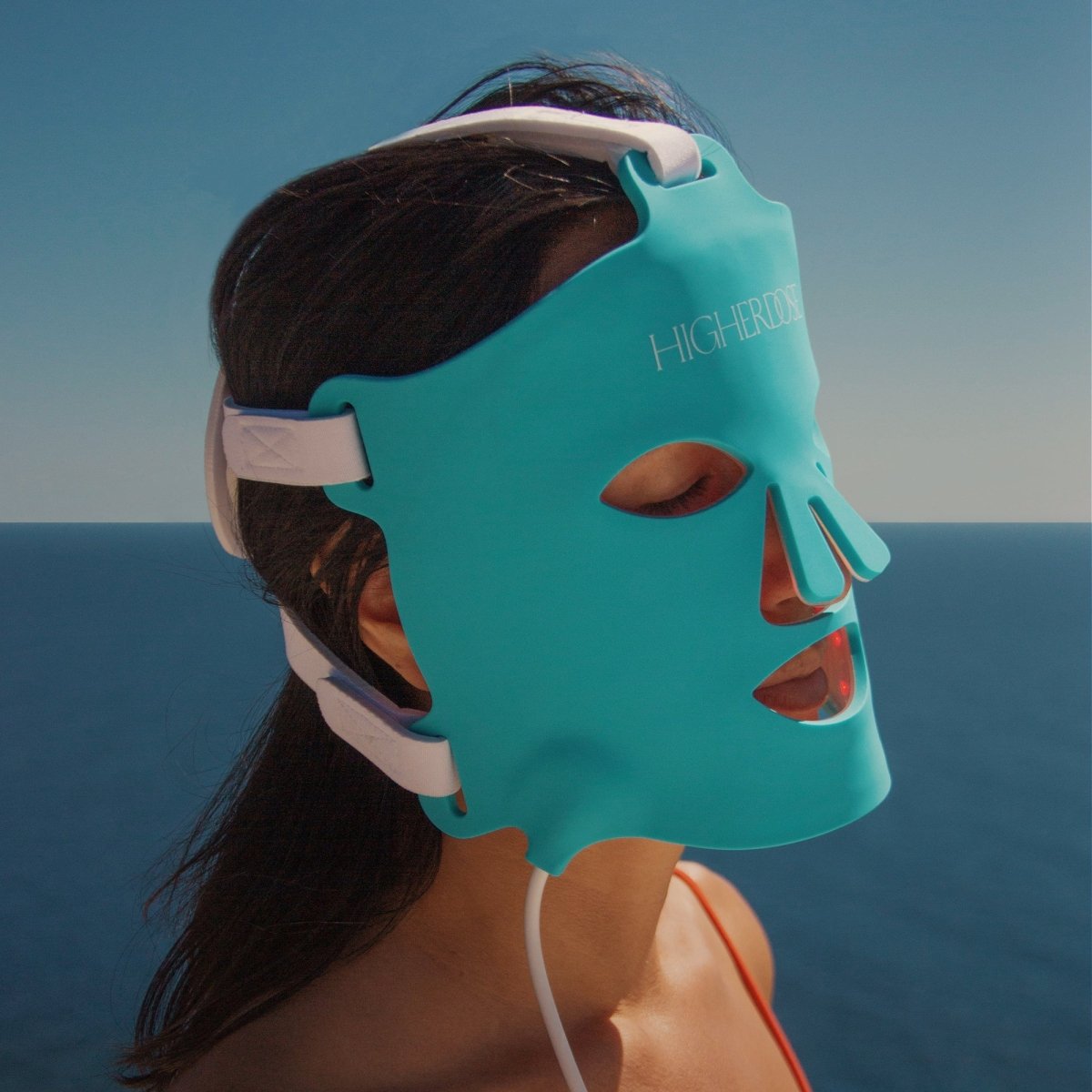 woman using HigherDOSE face mask 