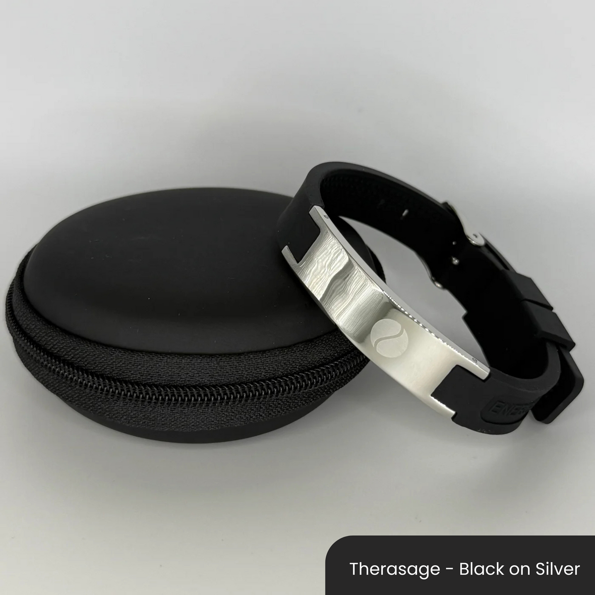 Therasage Bio Band Sport bracelet in Therasage - Black on Silver beside a black zip case