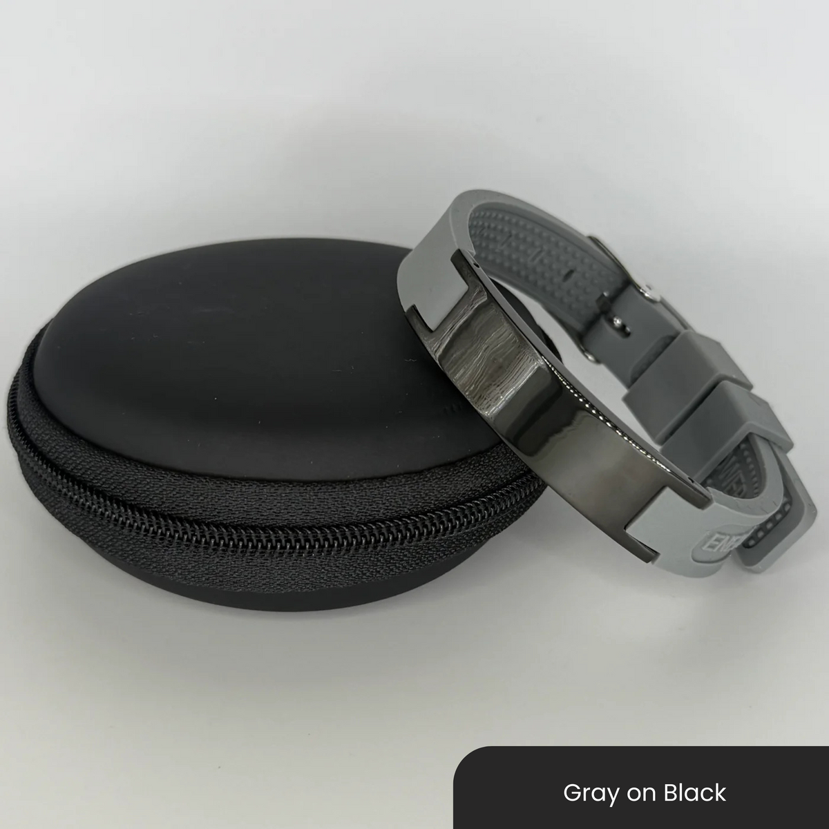 Therasage Bio Band Sport bracelet in Gray on Black beside a black zip case