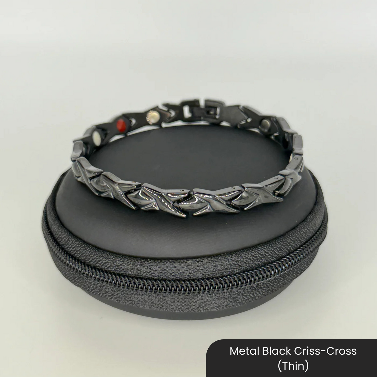 Therasage Bio Band metal bracelet in Metal Black Criss-Cross (Thin) on a black zip case