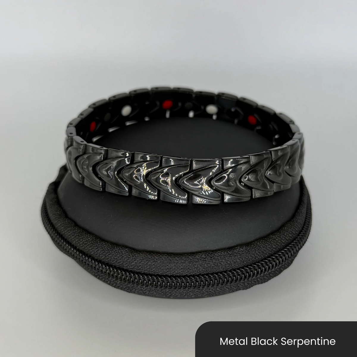 Therasage Bio Band metal bracelet in Metal Black Serpentine on a black zip case
