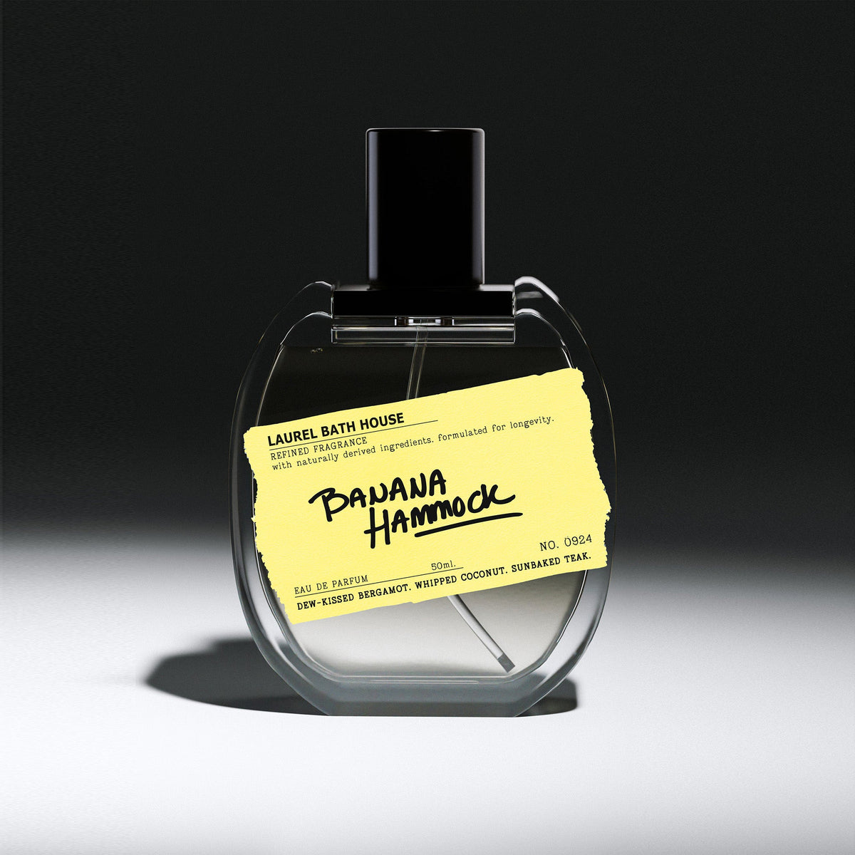 Laurel Bath House Banana Hammock Eau de Parfum 50 ml bottle with yellow label on a dark spotlit background