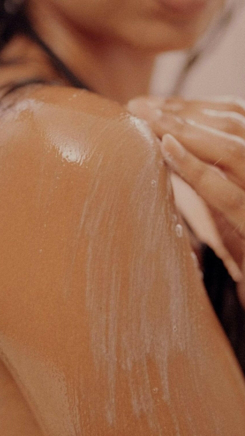 Firsthand Supply Tranquil Body Cleanser Refill (33.8oz): close-up of a woman's shoulder covered in body cleanser lather