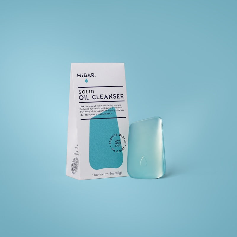 HiBAR Solid Oil Cleanser box with a teal oil cleanser bar on a blue background