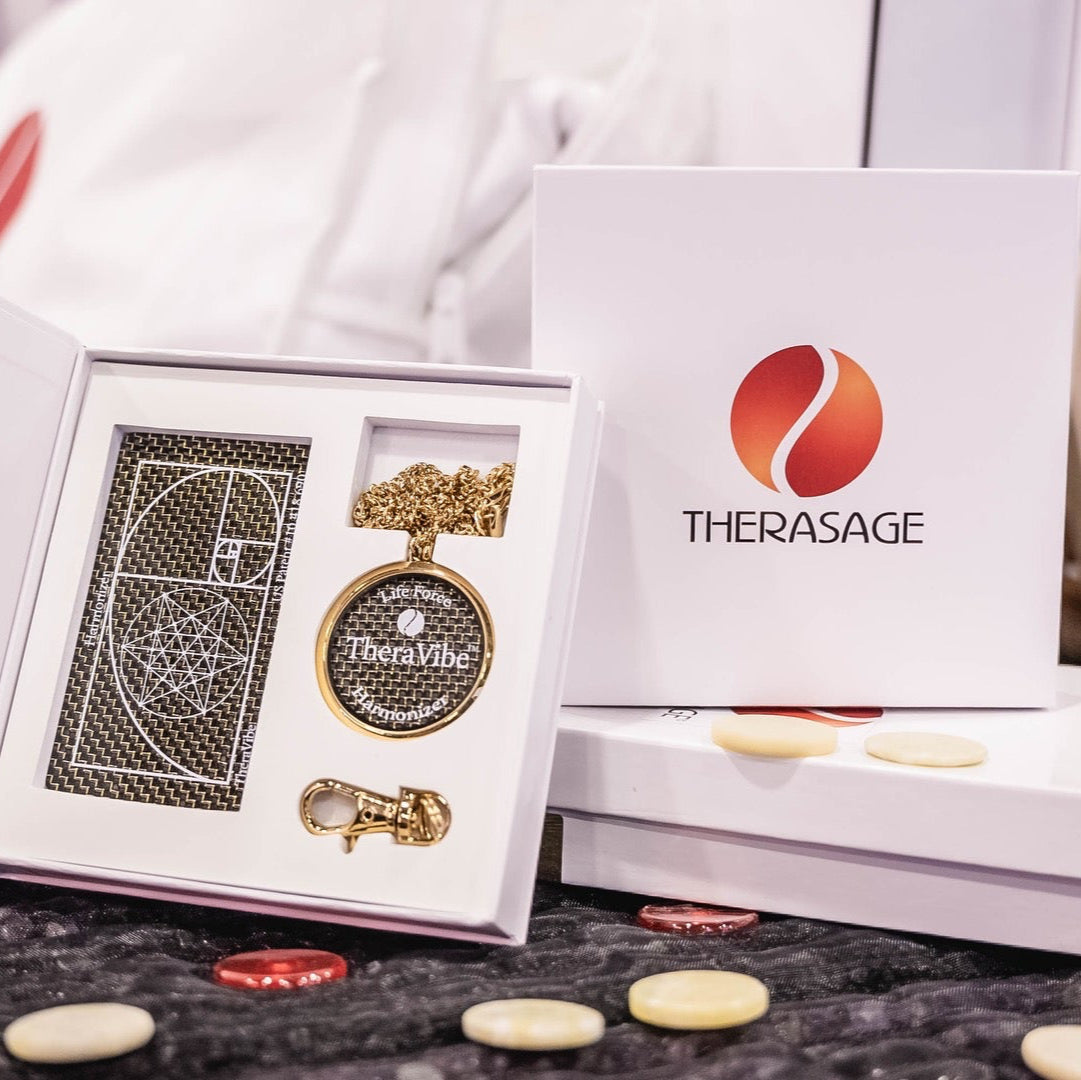 Therasage TheraVibe box set open beside the white Therasage outer box on a table
