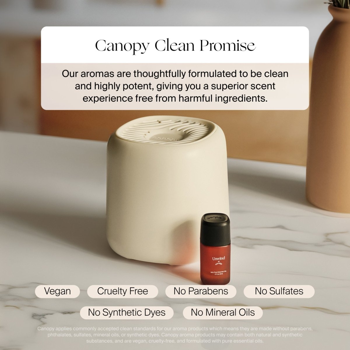 Canopy Aroma Diffuser in cream beside an aroma bottle: Canopy Clean Promise, vegan, cruelty free, no parabens or sulfates