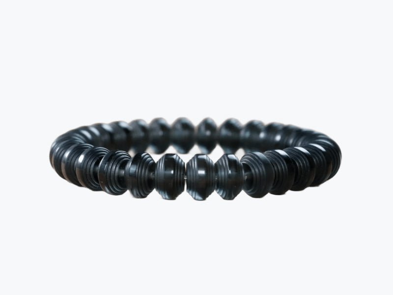 Somavedic Bracelet in black beads on a white background