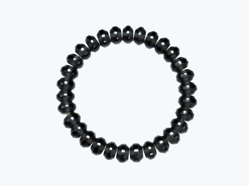 Somavedic black Bracelet laid flat in a circle on white
