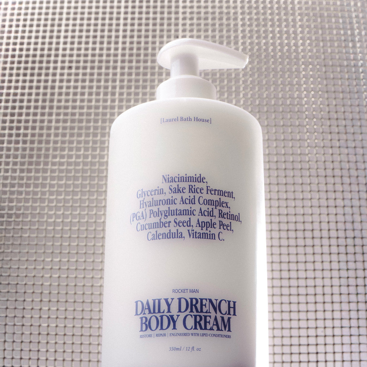Laurel Bath House Rocket Man Daily Drench Body Cream bottle on a mesh surface