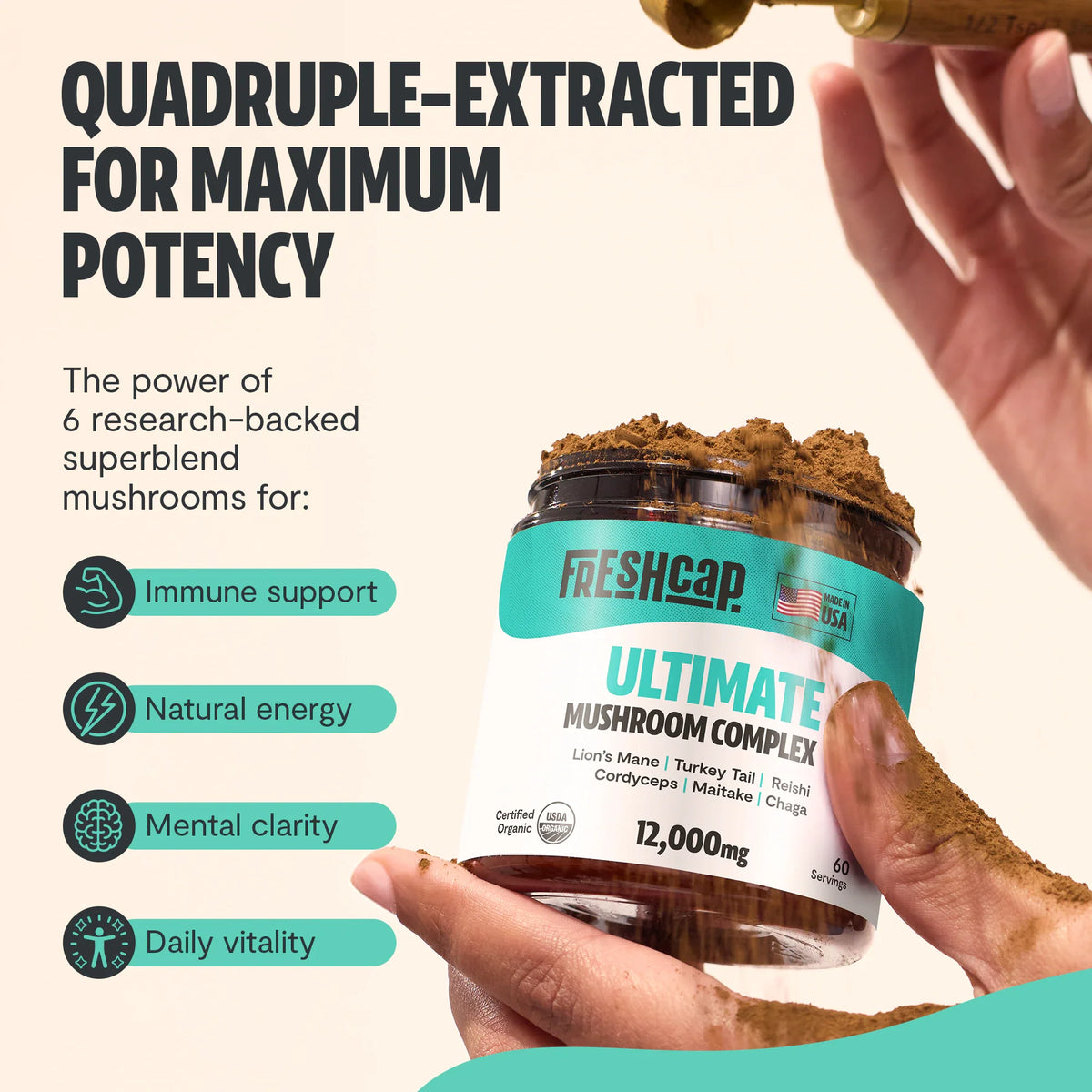 Hand holding a FreshCap Mushrooms Ultimate Mushroom Complex Powder jar: quadruple-extracted for immunity, energy, clarity
