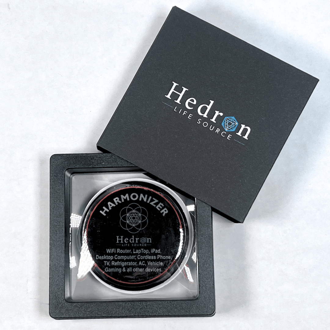 Open Hedron Life Source Harmonizer gift box showing the disc in its tray