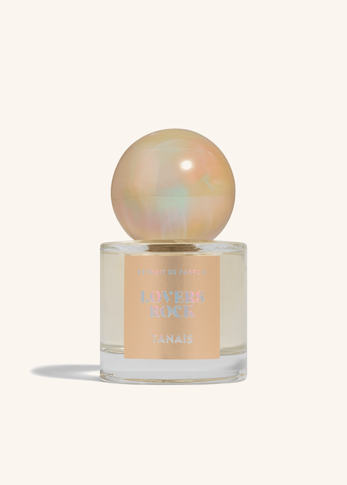 TANAÏS Lovers Rock Extrait de Parfum bottle with an opalescent pearl cap on a cream background