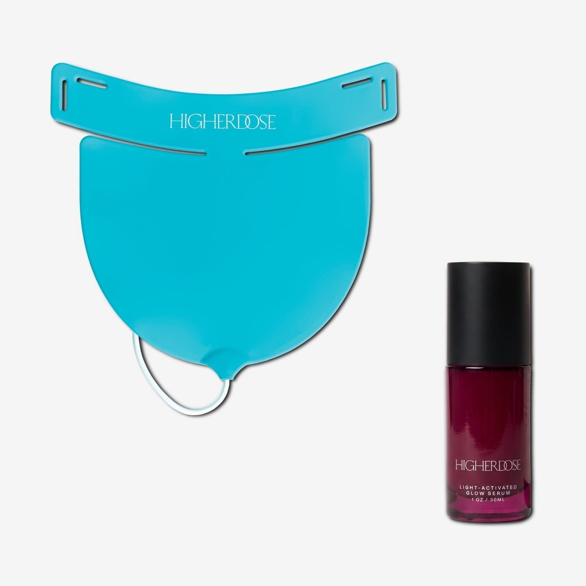 HigherDOSE Red Light Neck Enhancer in teal beside the Light-Activated Glow Serum bottle on white