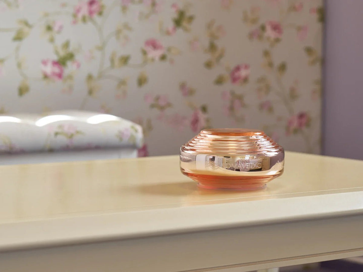 Somavedic Rosalin on a cream table beside floral wallpaper
