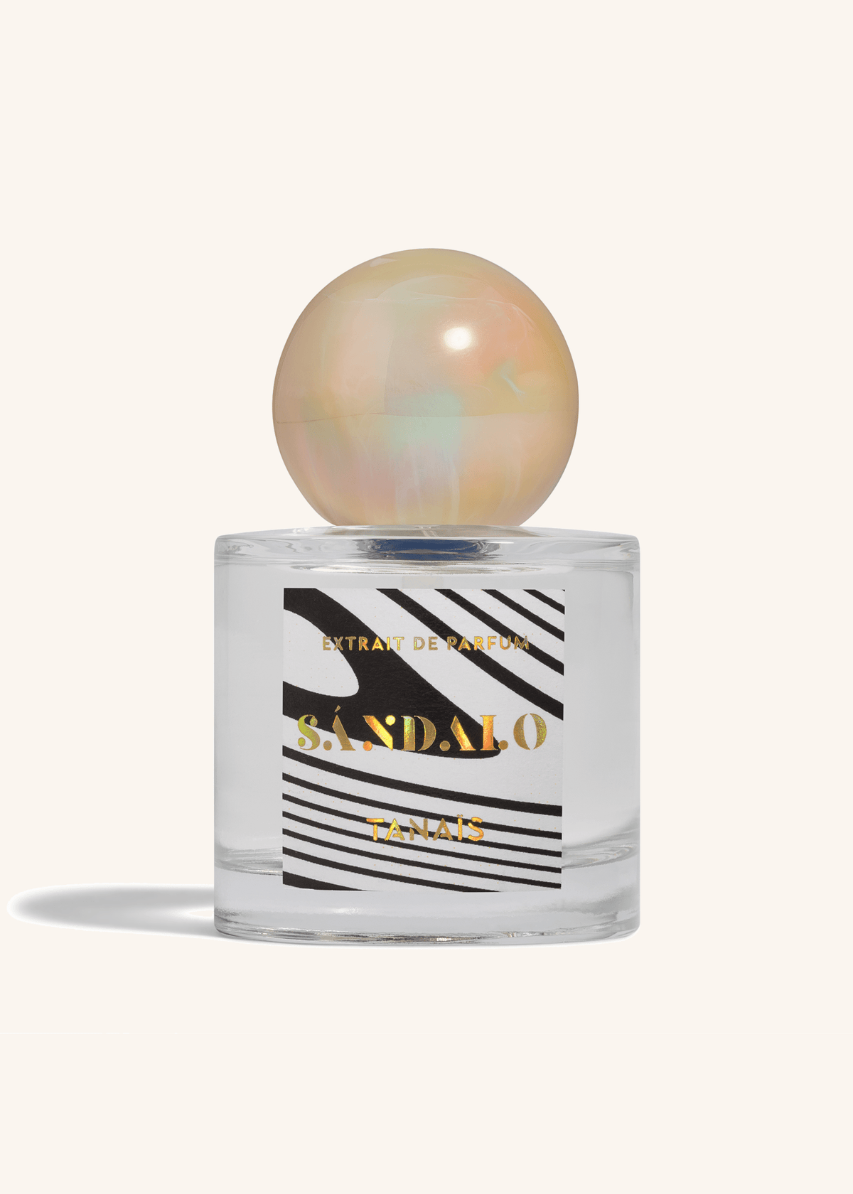 TANAÏS Sándalo Extrait de Parfum bottle with a black and white zebra stripe label and pearl cap, front view