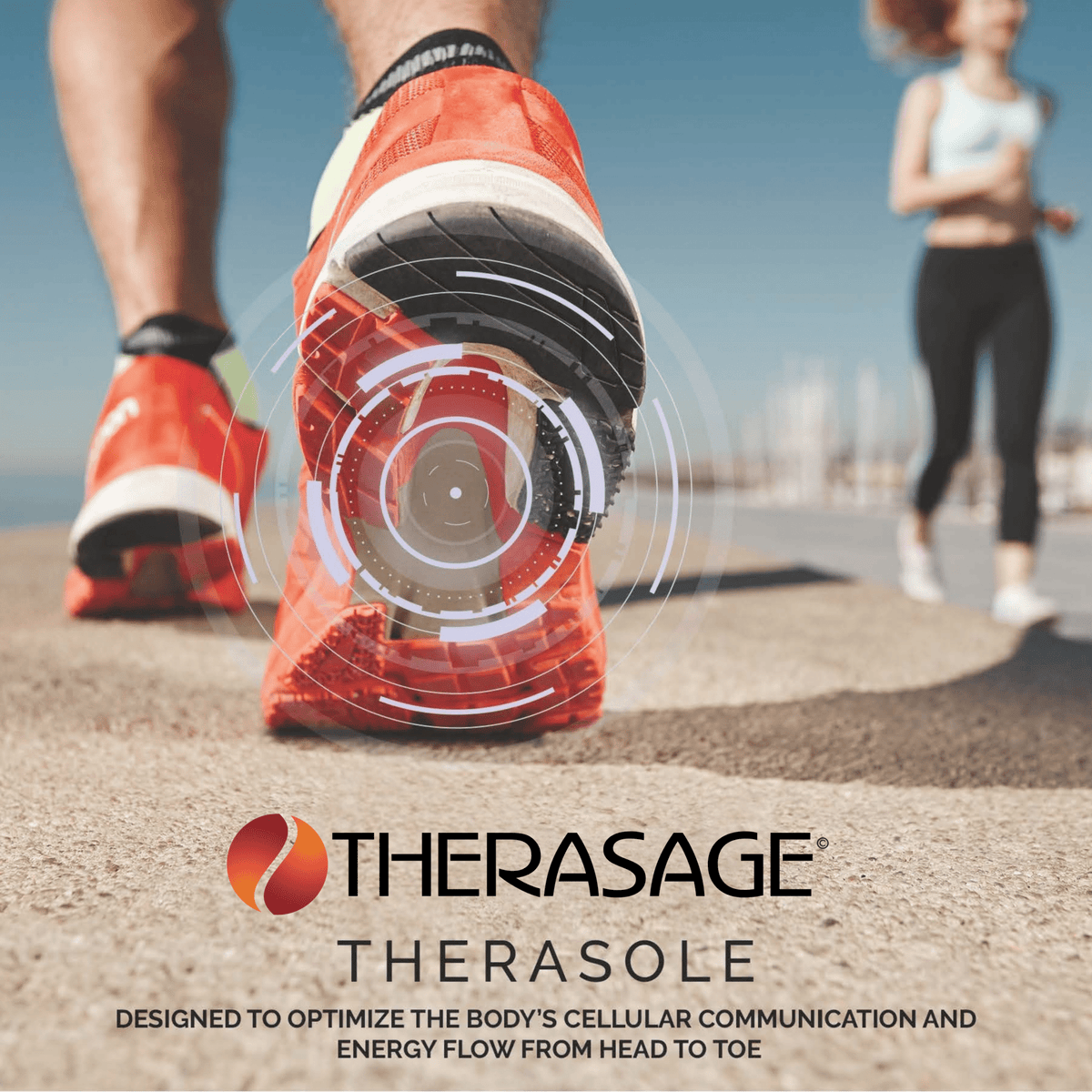 Runner's feet in orange running shoes with Therasage TheraSole insoles branding on the pavement